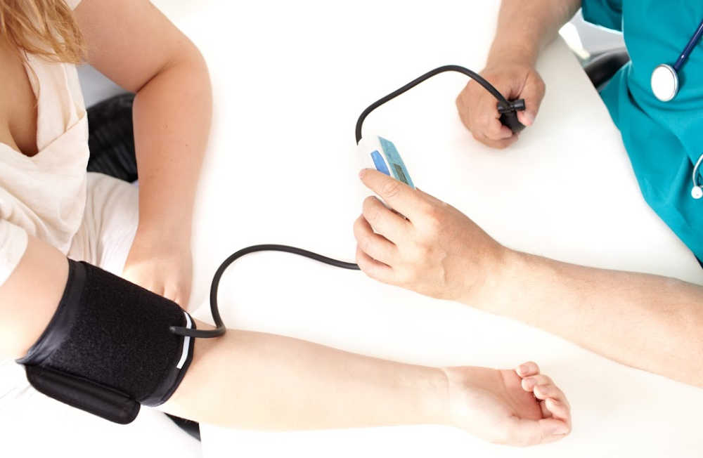 Woman gets blood pressure checked